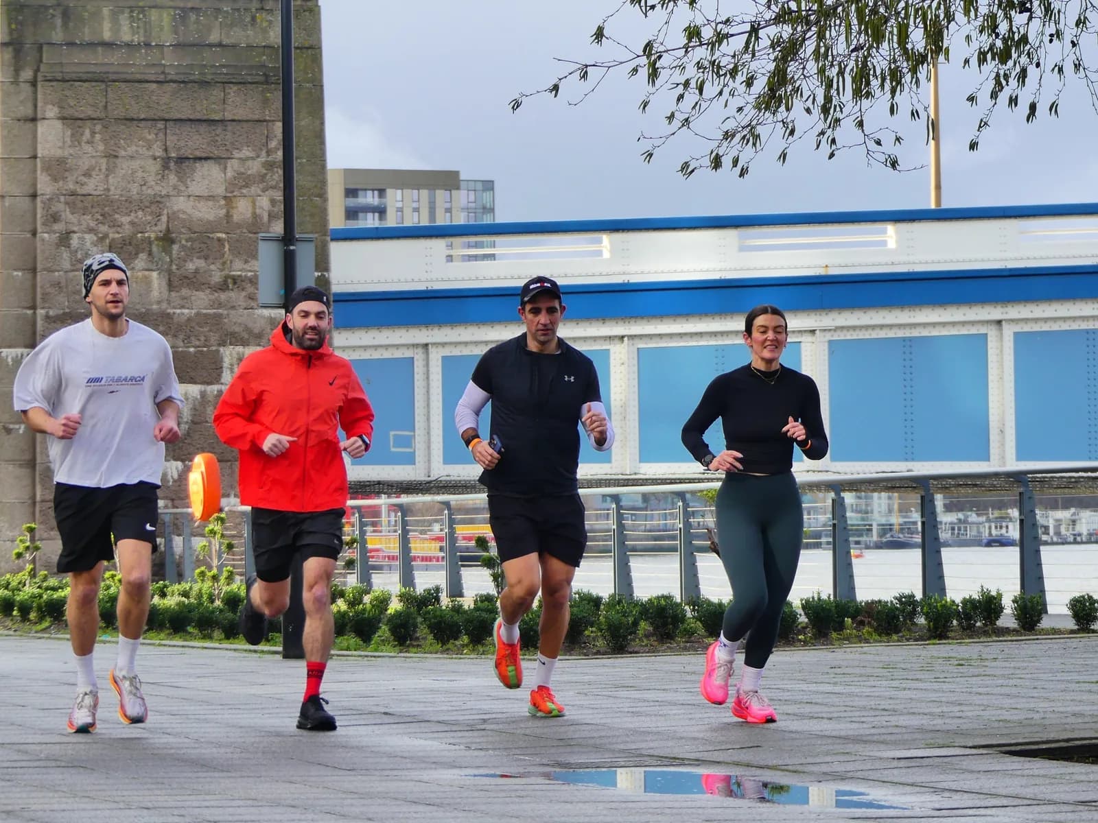 Runners training together by the river